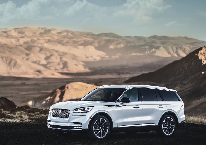 A Lincoln Aviator® SUV is parked on a scenic mountain overlook | White's Canyon Motors - Lincoln in Spearfish SD