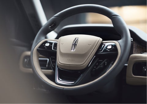 The intuitively placed controls of the steering wheel on a 2023 Lincoln Aviator® SUV | White's Canyon Motors - Lincoln in Spearfish SD