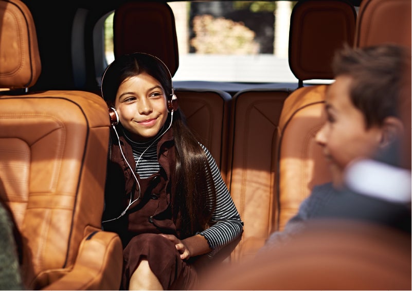 Two young people are comfortably seated in the second and third rows of a Lincoln Aviator® SUV | White's Canyon Motors - Lincoln in Spearfish SD