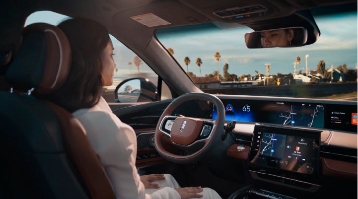 A person is shown driving hands-free on the highway with available Lincoln BlueCruise technology. | White's Canyon Motors - Lincoln in Spearfish SD