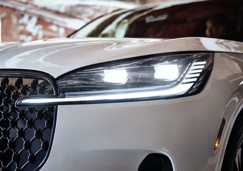 A close-up of a headlamp on the 2025 Lincoln Aviator® SUV is shown. | White's Canyon Motors - Lincoln in Spearfish SD
