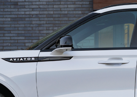 The driver’s door of a white 2025 Lincoln Aviator® SUV is showcased. | White's Canyon Motors - Lincoln in Spearfish SD