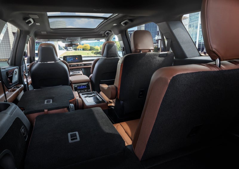 The interior of the 2025 Lincoln Aviator® SUV is shown with two seats folded down for added space. | White's Canyon Motors - Lincoln in Spearfish SD