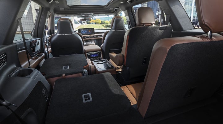One side of the PowerFold® third-row seat and a second-row seat are folded forward in the 2026 Lincoln Aviator® SUV. | White's Canyon Motors - Lincoln in Spearfish SD