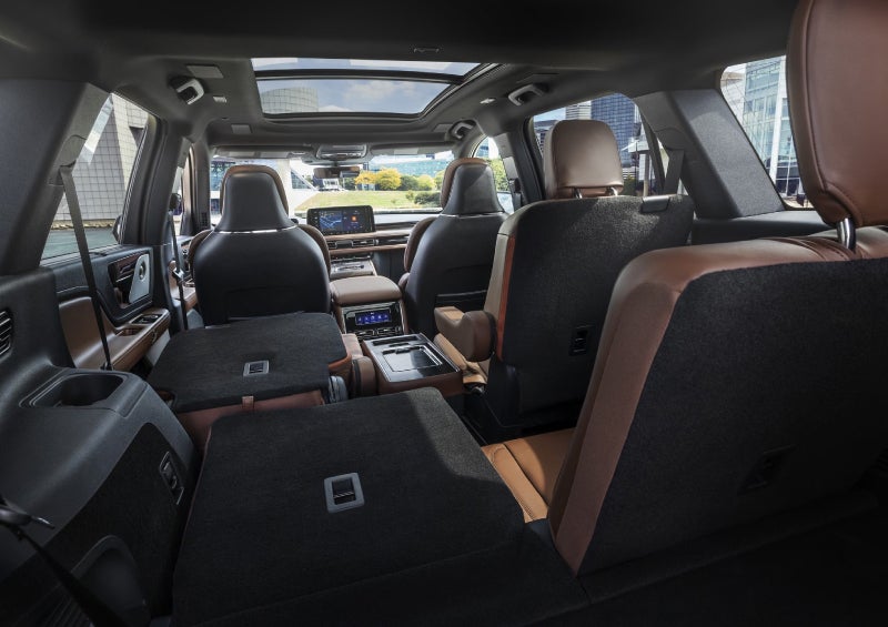 One side of the PowerFold® third-row seat and a second-row seat are folded forward in the 2026 Lincoln Aviator® SUV. | White's Canyon Motors - Lincoln in Spearfish SD