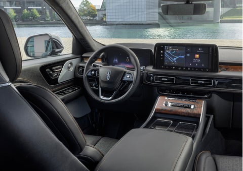 The interior of the 2026 Lincoln Aviator® SUV is shown parked with a view of a harbor through the windshield. | White's Canyon Motors - Lincoln in Spearfish SD