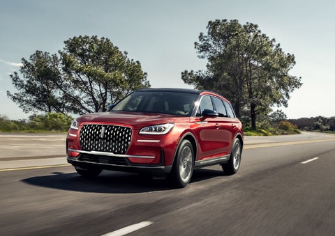 A 2026 Lincoln Corsair® SUV is shown being driven on a country road. | White's Canyon Motors - Lincoln in Spearfish SD