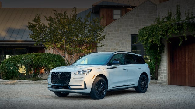 A 2026 Lincoln Corsair® SUV is parked in front off a luxury home. | White's Canyon Motors - Lincoln in Spearfish SD