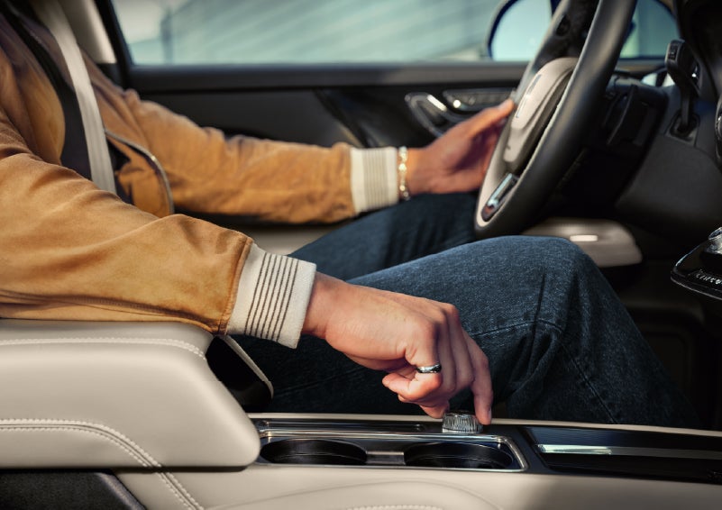 The driver of a 2026 Lincoln Corsair® SUV is shown selecting a drive mode. | White's Canyon Motors - Lincoln in Spearfish SD