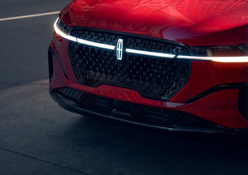 The available front LED light bar and center Lincoln Star logo glow at dusk. | White's Canyon Motors - Lincoln in Spearfish SD