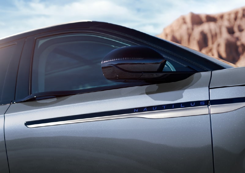 Blue lettering on the side of the vehicle that reads Nautilus indicates the available Hybrid Powertrain. | White's Canyon Motors - Lincoln in Spearfish SD