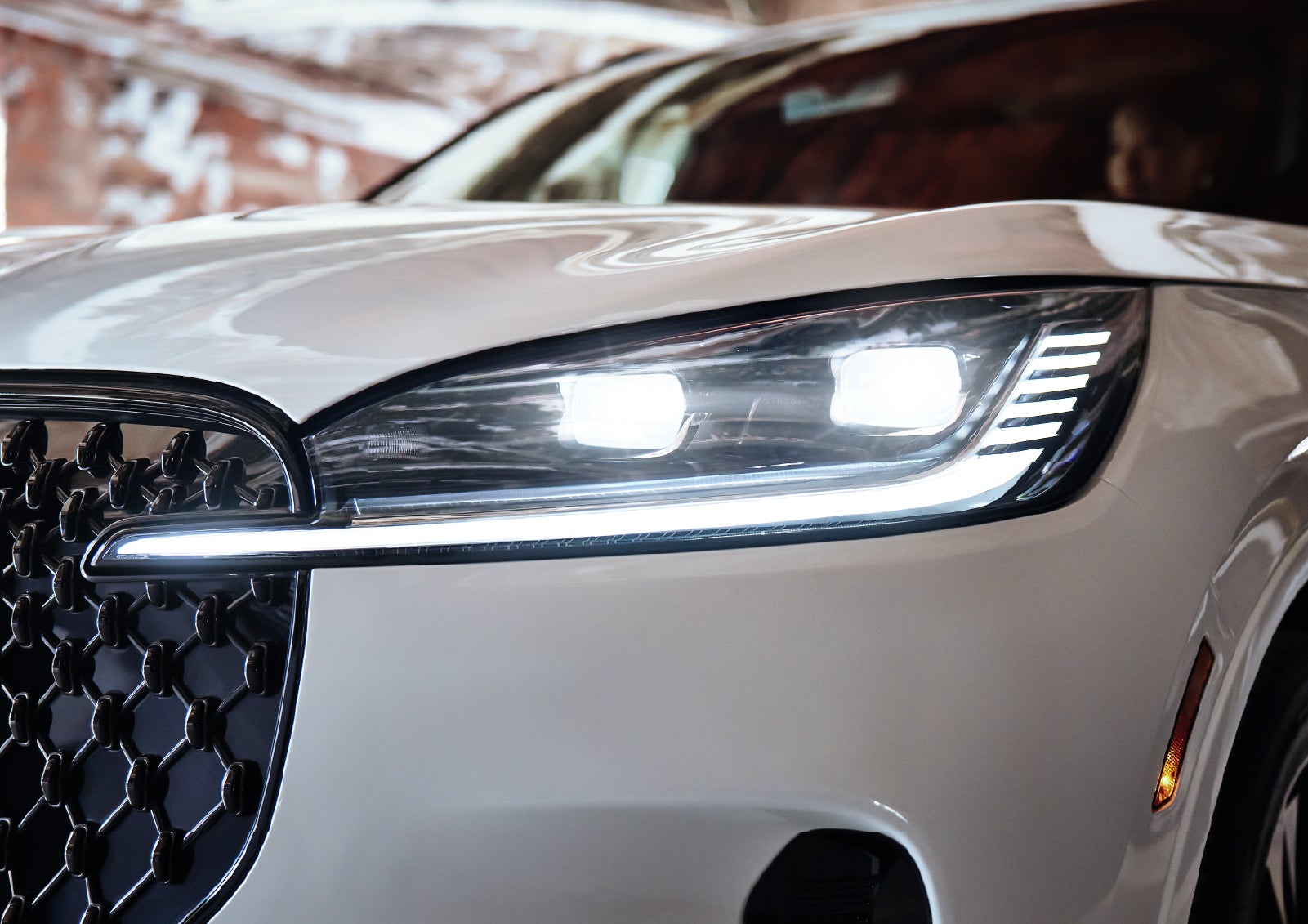 A close-up of a headlamp on the 2027 Lincoln Aviator® SUV is shown. | White's Canyon Motors - Lincoln in Spearfish SD