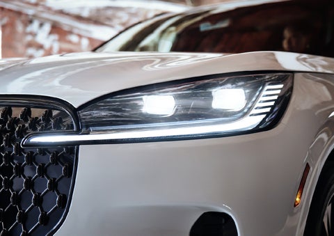 A close-up of a headlamp on the 2027 Lincoln Aviator® SUV is shown. | White's Canyon Motors - Lincoln in Spearfish SD
