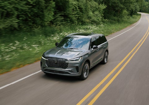 A 2027 Lincoln Aviator® SUV is being driven down a road. | White's Canyon Motors - Lincoln in Spearfish SD