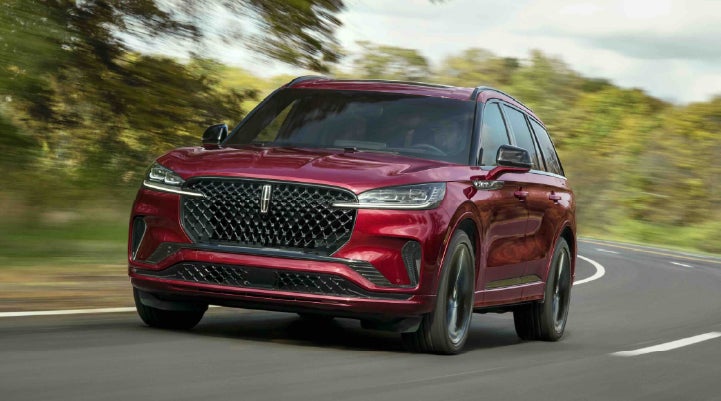 A 2027 Lincoln Aviator® SUV is being driven on a country road | White's Canyon Motors - Lincoln in Spearfish SD