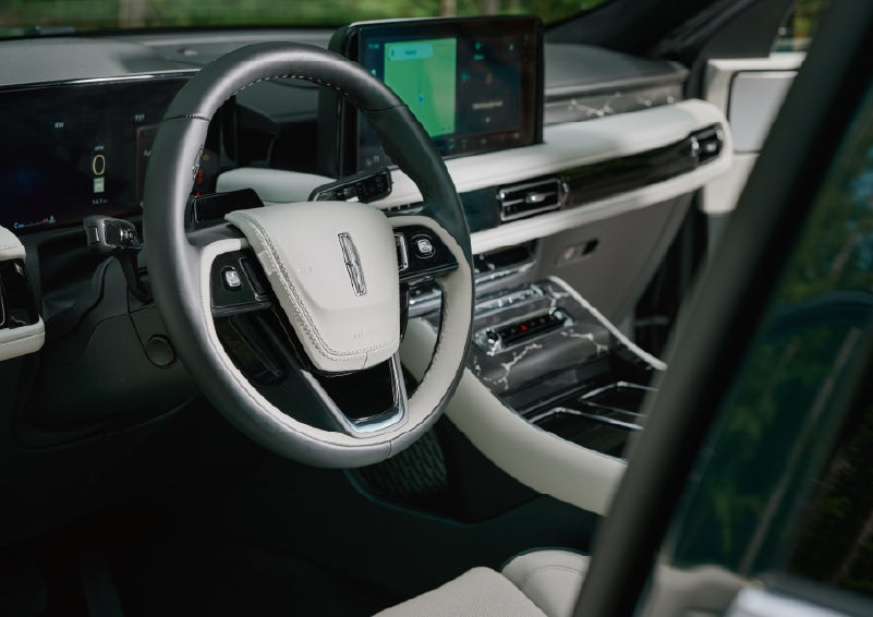 The leather-trimmed steering wheel of a 2027 Lincoln Aviator® Black Label™ SUV. | White's Canyon Motors - Lincoln in Spearfish SD